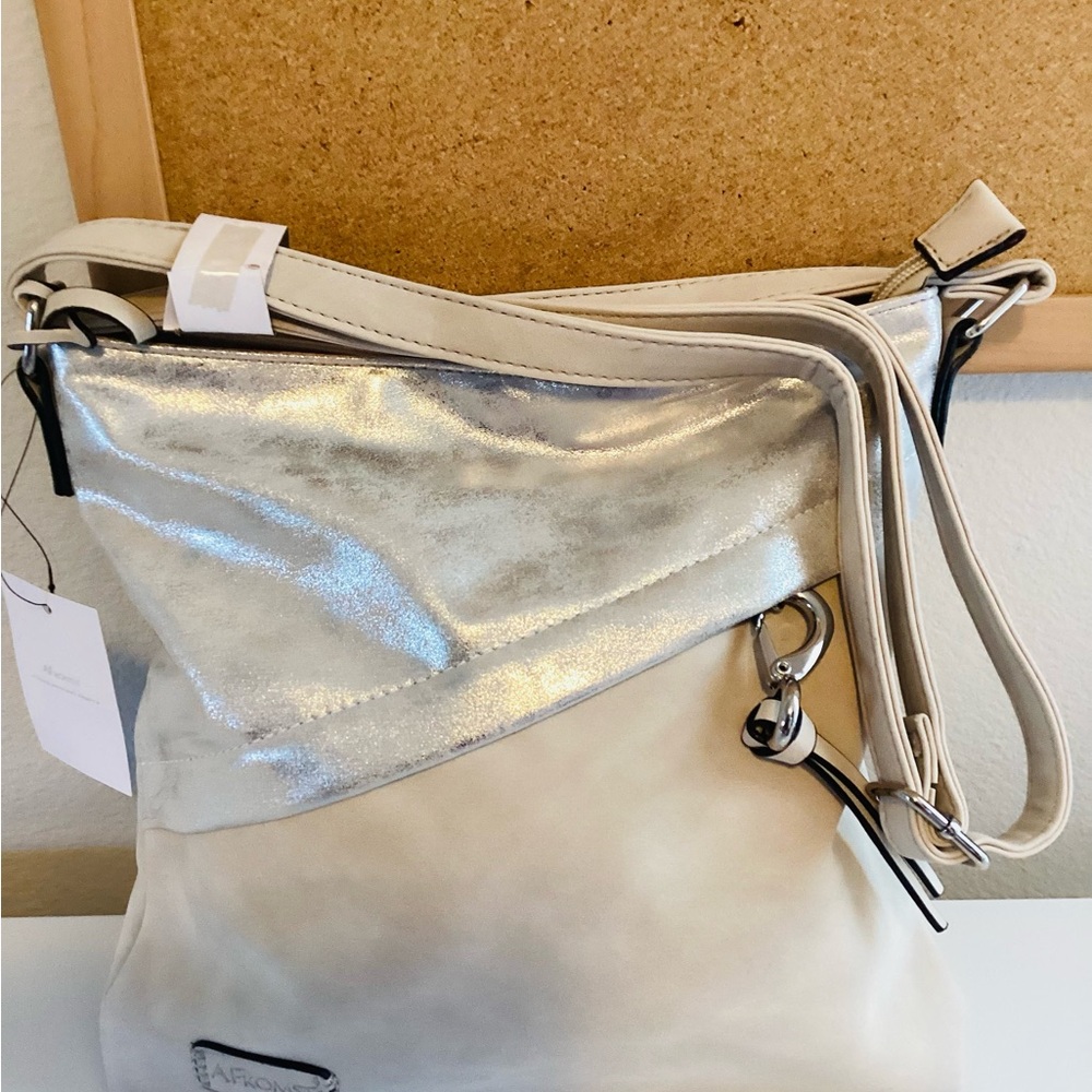 stunning cream and silver shoulder bag that's perfect for any occasion.